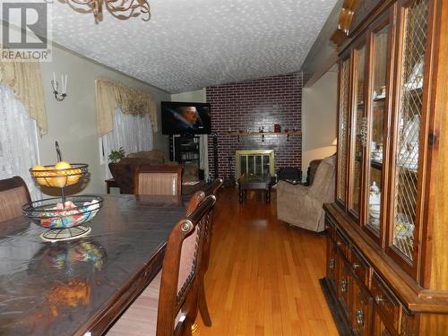 13 Dosco Hill, Bell Island, NL - Indoor Photo Showing Dining Room With Fireplace