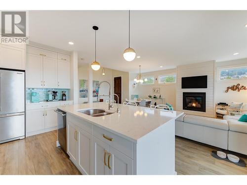 1726 Lake Vista Road, Kelowna, BC - Indoor Photo Showing Kitchen With Fireplace With Double Sink
