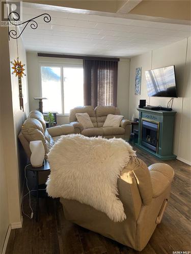 317 Aldridge Street, Bienfait, SK - Indoor Photo Showing Living Room With Fireplace