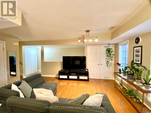 303 - 64 Sidney Belsey Crescent, Toronto, ON - Indoor Photo Showing Living Room