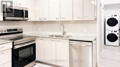#234 -652 Princess St, Kingston, ON - Indoor Photo Showing Kitchen With Double Sink