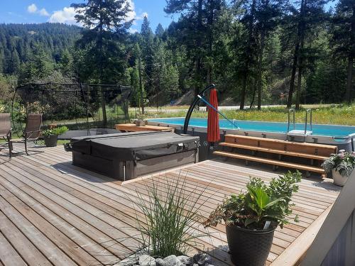 2111 Dunn Road, Christina Lake, BC - Outdoor With Above Ground Pool With Deck Patio Veranda With Backyard