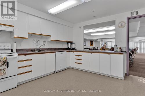 211 - 8 Huron Street, Kawartha Lakes, ON - Indoor Photo Showing Kitchen With Double Sink