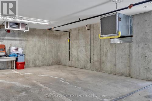 211 - 8 Huron Street, Kawartha Lakes, ON - Indoor Photo Showing Garage