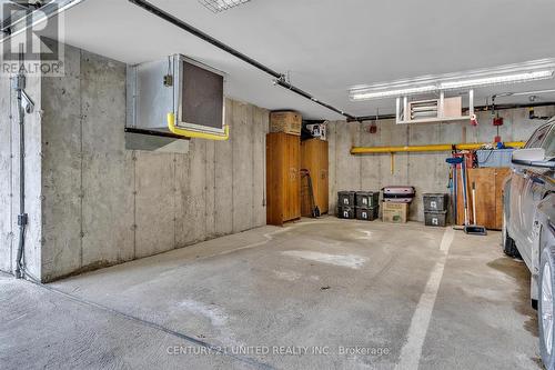 #211 -8 Huron St, Kawartha Lakes, ON - Indoor Photo Showing Garage