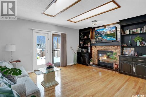 3407 Olive Grove, Regina, SK - Indoor Photo Showing Living Room With Fireplace