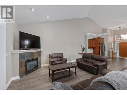 1566 Large Avenue, Kelowna, BC - Indoor Photo Showing Living Room With Fireplace