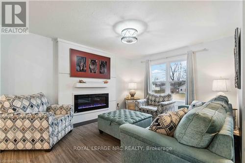 83 Gordon Ave, Fort Erie, ON - Indoor Photo Showing Living Room With Fireplace