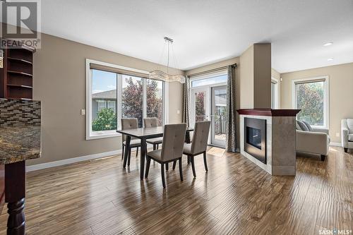 3877 Goldfinch Way, Regina, SK - Indoor Photo Showing Dining Room With Fireplace