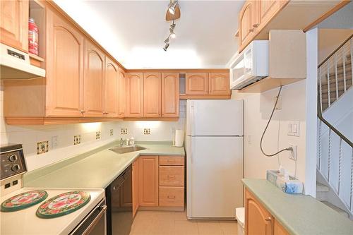 Spacious Kitchen with b/i dishwasher and tile floor - 2001 Bonnymede Drive|Unit #140, Mississauga, ON - Indoor Photo Showing Kitchen