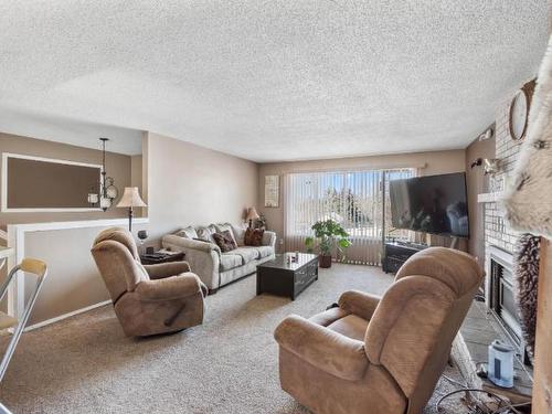 241 Birch Cres, Logan Lake, BC - Indoor Photo Showing Living Room With Fireplace