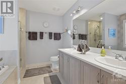Primary en-suite with double sinks, soaker tub and spacious stand up shower - 