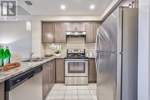 #118 -630 Sauve St E, Milton, ON - Indoor Photo Showing Kitchen With Stainless Steel Kitchen With Double Sink
