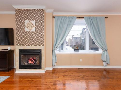 Salon - 4510 Boul. St-Martin O., Laval (Chomedey), QC - Indoor Photo Showing Other Room With Fireplace