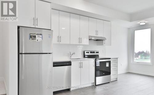19 - 3429 Ridgeway Drive E, Mississauga, ON - Indoor Photo Showing Kitchen With Upgraded Kitchen