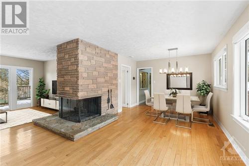 5466 North Drive, Ottawa, ON - Indoor Photo Showing Living Room With Fireplace