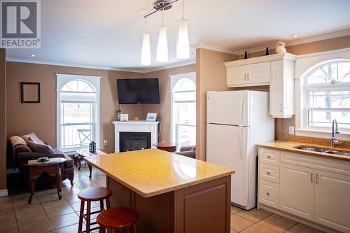 9 Hancock'S Lane, Botwood, NL - Indoor Photo Showing Kitchen With Fireplace With Double Sink