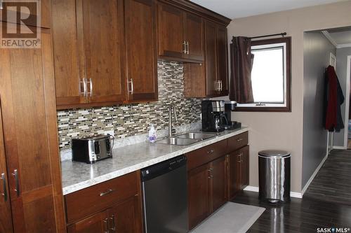 64 10Th Street, Weyburn, SK - Indoor Photo Showing Kitchen With Double Sink