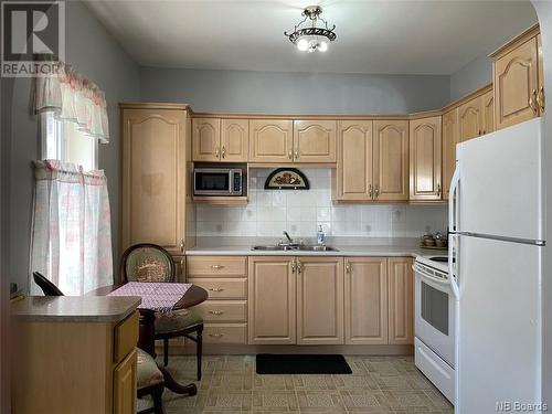 59-59A Sunset Drive, Campbellton, NB - Indoor Photo Showing Kitchen With Double Sink