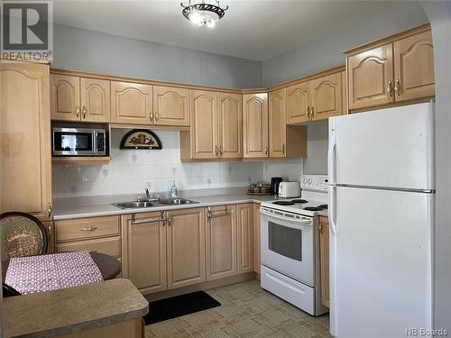 59-59A Sunset Drive, Campbellton, NB - Indoor Photo Showing Kitchen With Double Sink