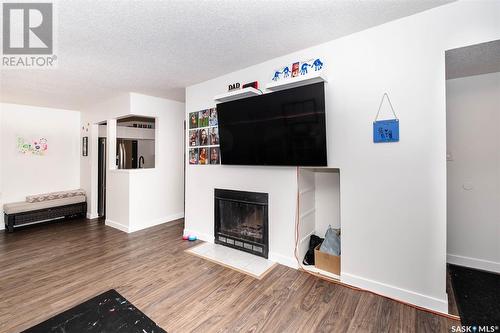 194 160 Gore Place, Regina, SK - Indoor Photo Showing Living Room With Fireplace