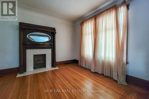 17 Barnesdale Ave N, Hamilton, ON - Indoor Photo Showing Other Room With Fireplace