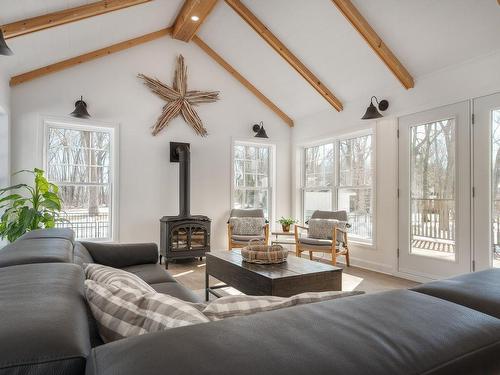 Family room - 60 Av. Tunstall, Senneville, QC - Indoor Photo Showing Living Room With Fireplace