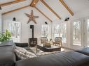 Family room - 60 Av. Tunstall, Senneville, QC  - Indoor Photo Showing Living Room With Fireplace 