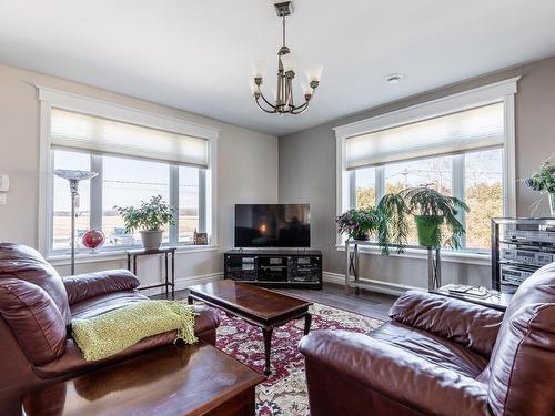 Vue d'ensemble - 1167 Ch. Molleur, Pike River, QC - Indoor Photo Showing Living Room With Fireplace