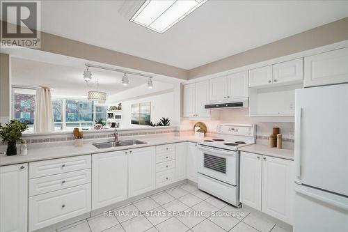 #110 -50 The Boardwalk Way, Markham, ON - Indoor Photo Showing Kitchen With Double Sink