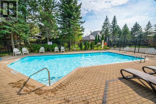 #110 -50 The Boardwalk Way, Markham, ON - Outdoor With In Ground Pool With Deck Patio Veranda With Backyard