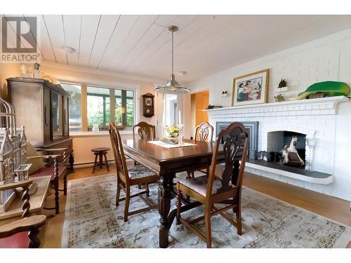 829 Prince George Pulpmill Road, Prince George, BC - Indoor Photo Showing Dining Room With Fireplace