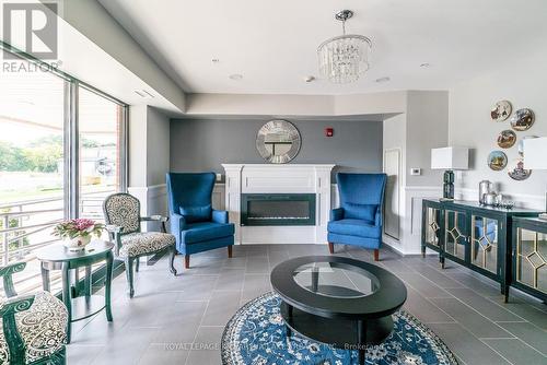 #205 -58 Glenelg St W, Kawartha Lakes, ON - Indoor Photo Showing Living Room With Fireplace