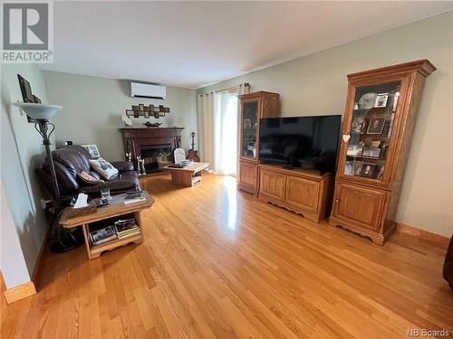 55 Montagnes Street, Kedgwick, NB - Indoor Photo Showing Living Room With Fireplace