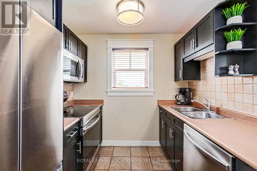 206 - 115 Fairway Court, Blue Mountains, ON - Indoor Photo Showing Kitchen With Double Sink