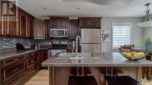 D4 33 Wood Lily Drive, Moose Jaw, SK - Indoor Photo Showing Kitchen With Double Sink With Upgraded Kitchen