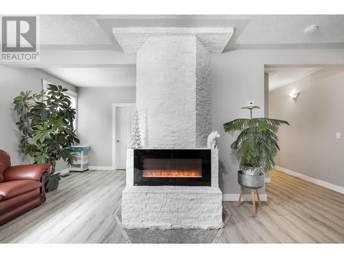 7880 Pleasant Valley Road, Vernon, BC - Indoor Photo Showing Living Room With Fireplace