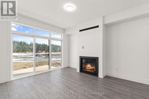 84 George Wright Boulevard, Prince Edward County, ON - Indoor Photo Showing Living Room With Fireplace