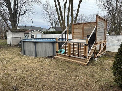 Backyard - 38 33E Avenue, Sainte-Marthe-Sur-Le-Lac, QC - Outdoor With Above Ground Pool With Exterior