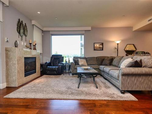 306-3223 Selleck Way, Colwood, BC - Indoor Photo Showing Living Room With Fireplace