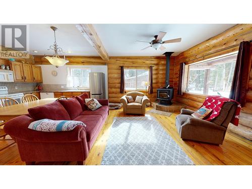 4977 Plateau Road, 108 Mile Ranch, BC - Indoor Photo Showing Living Room With Fireplace
