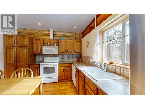 4977 Plateau Road, 108 Mile Ranch, BC - Indoor Photo Showing Kitchen With Double Sink