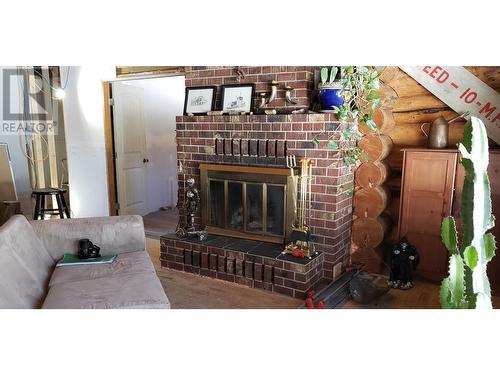 6694 Fawn Creek Road, 100 Mile House, BC - Indoor Photo Showing Living Room With Fireplace