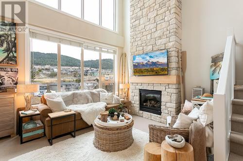 7343 Okanagan Landing Road Unit# 2404, Vernon, BC - Indoor Photo Showing Living Room With Fireplace