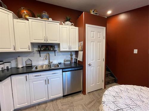 122 6Th Avenue S, Swan River, MB - Indoor Photo Showing Kitchen With Double Sink