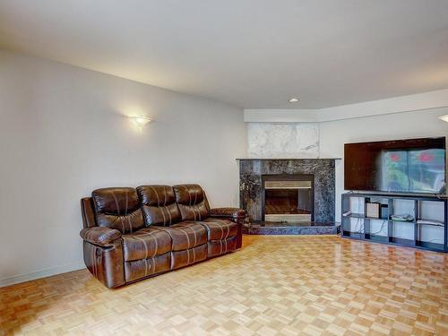 Family room - 31 Rue Dufferin, Kirkland, QC - Indoor Photo Showing Living Room With Fireplace