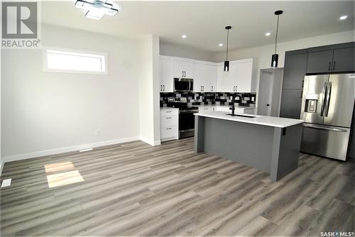 171 Schmeiser Lane, Saskatoon, SK - Indoor Photo Showing Kitchen With Upgraded Kitchen