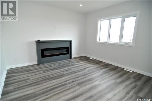 171 Schmeiser Lane, Saskatoon, SK - Indoor Photo Showing Living Room With Fireplace