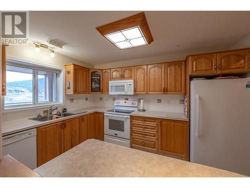 2255 Atkinson Street Unit# 705, Penticton, BC - Indoor Photo Showing Kitchen With Double Sink