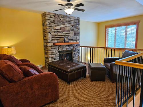 103 - 41 Rivermount Place, Fernie, BC - Indoor Photo Showing Other Room With Fireplace